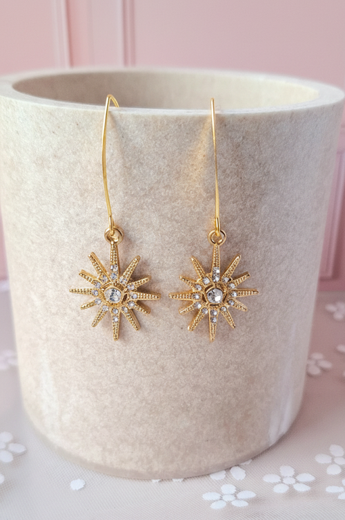 Boucles étoile dorée - fond rose poudré